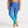 Blue patterned swim leggings worn by a person on a white background