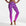 Person wearing purple swim leggings with shell pattern on a white background