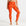 Person wearing orange patterned swim leggings on a white background