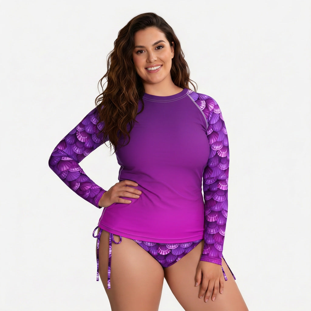 Woman wearing a purple long-sleeve rash guard on a white background